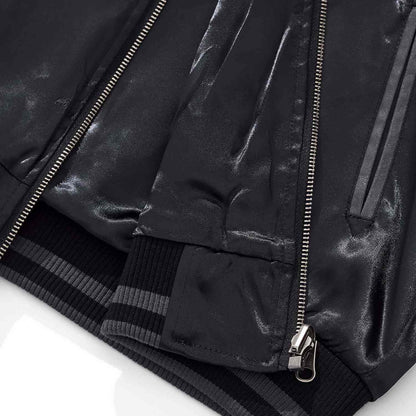 Hem rib and front zipper with pocket opening detail.