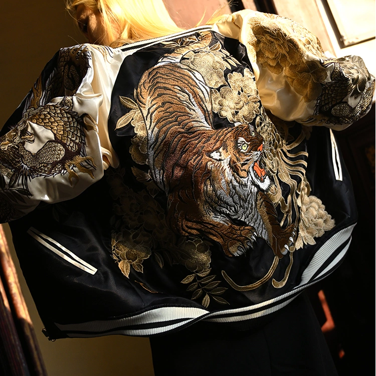On-body back view — beige sleeves; roaring tiger with chrysanthemum embroidery; dragons continue on sleeves.
