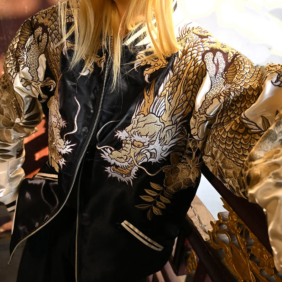 On-body front view — beige sleeves; twin dragon heads on chest, scaled dragons on sleeves, chrysanthemum accents.