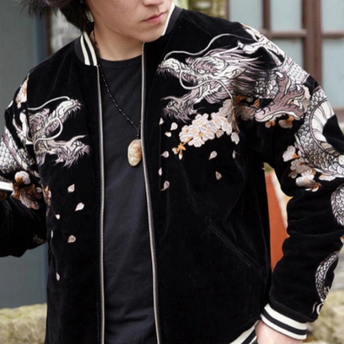 Lifestyle — model wearing velvet sukajan (Black), front view; dragon and sakura motifs across chest and sleeves.