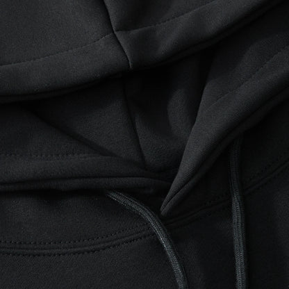 Hood lining and drawcord detail on the black hoodie with neat stitching