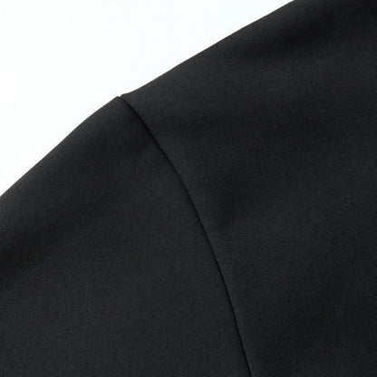 Shoulder seam detail on the black hoodie with smooth fabric and tidy seams