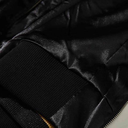 Close-up of solid black ribbed hem and glossy satin body on Crows Suzuran vs Housen rivalry sukajan.