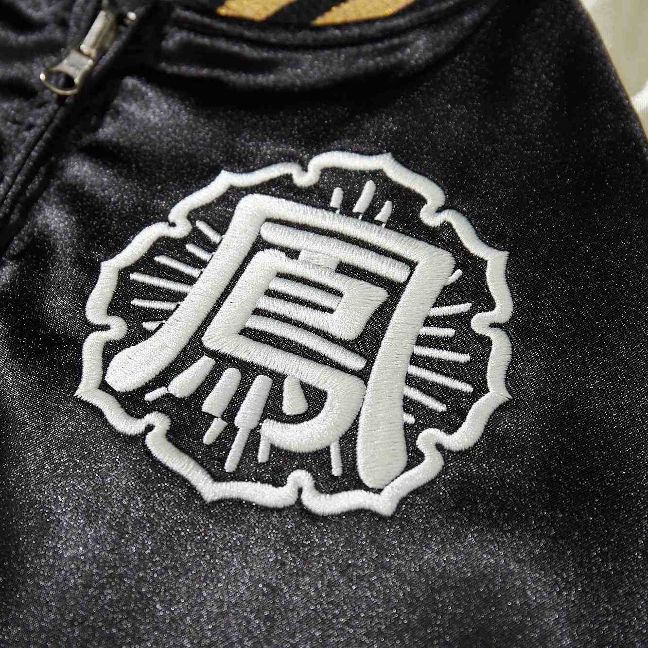 Close-up of bold kanji Housen high school crest embroidery on chest of Crows Suzuran vs Housen rivalry Japanese sukajan jacket.