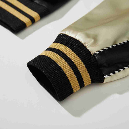 Detail of beige sleeve and black ribbed cuff with gold stripes on Crows Suzuran vs Housen rivalry sukajan jacket.