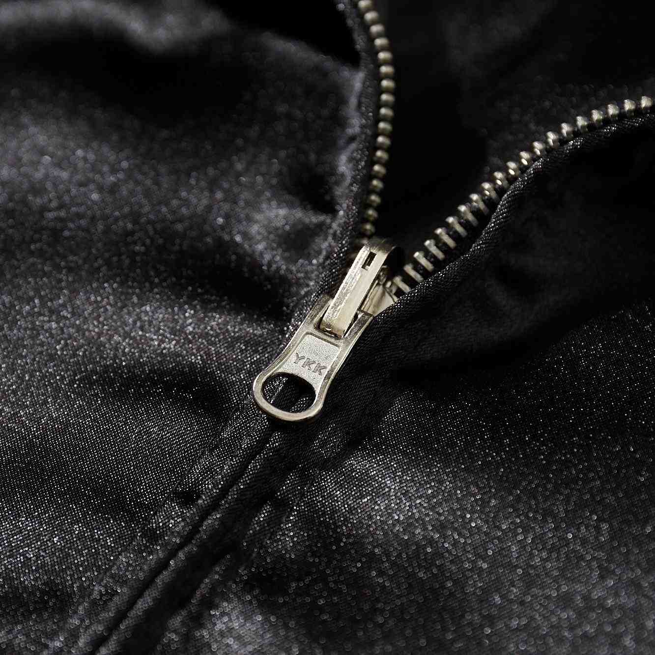 Macro detail of sturdy YKK metal zipper on black satin Crows Suzuran vs Housen sukajan jacket.