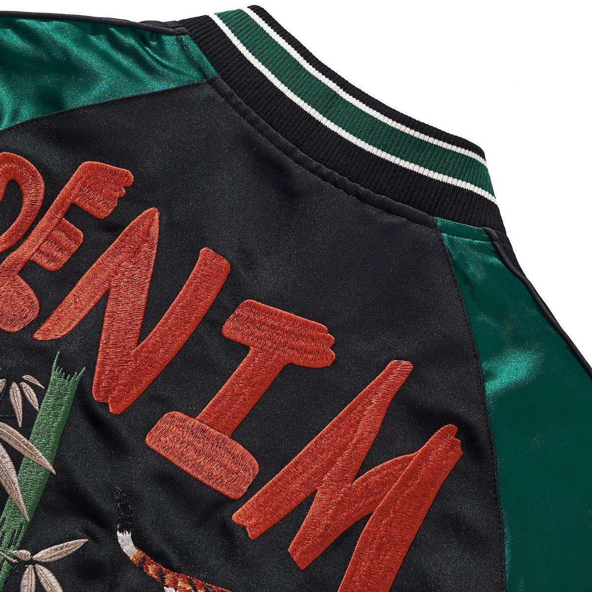 Raised satin-stitch “DENIM” lettering on the back yoke