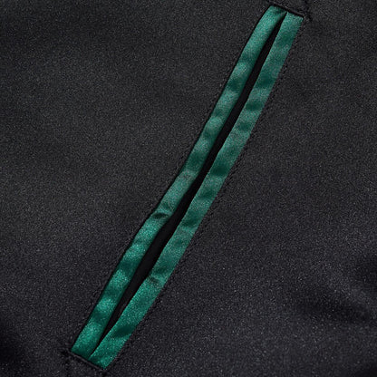 Slanted welt pocket trimmed with emerald-green satin piping