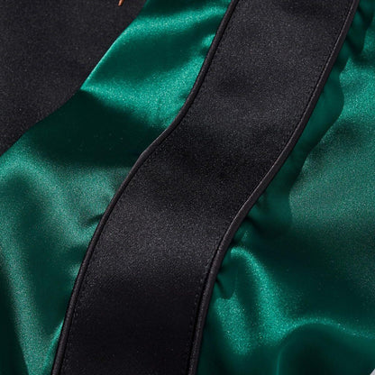 Deep-green satin sleeve panel with neat black stripe and piping
