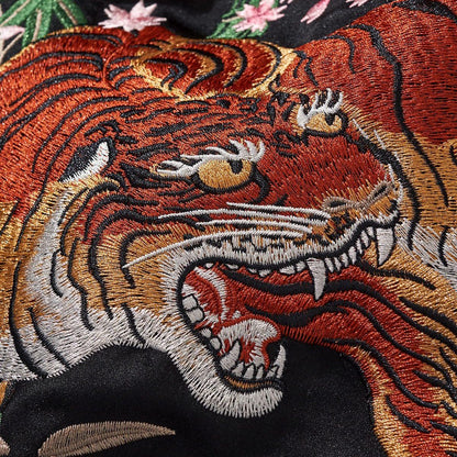 Tiger head embroidery close-up highlighting color gradients and texture