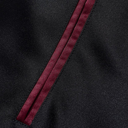 Close-up of welt pocket with burgundy satin piping