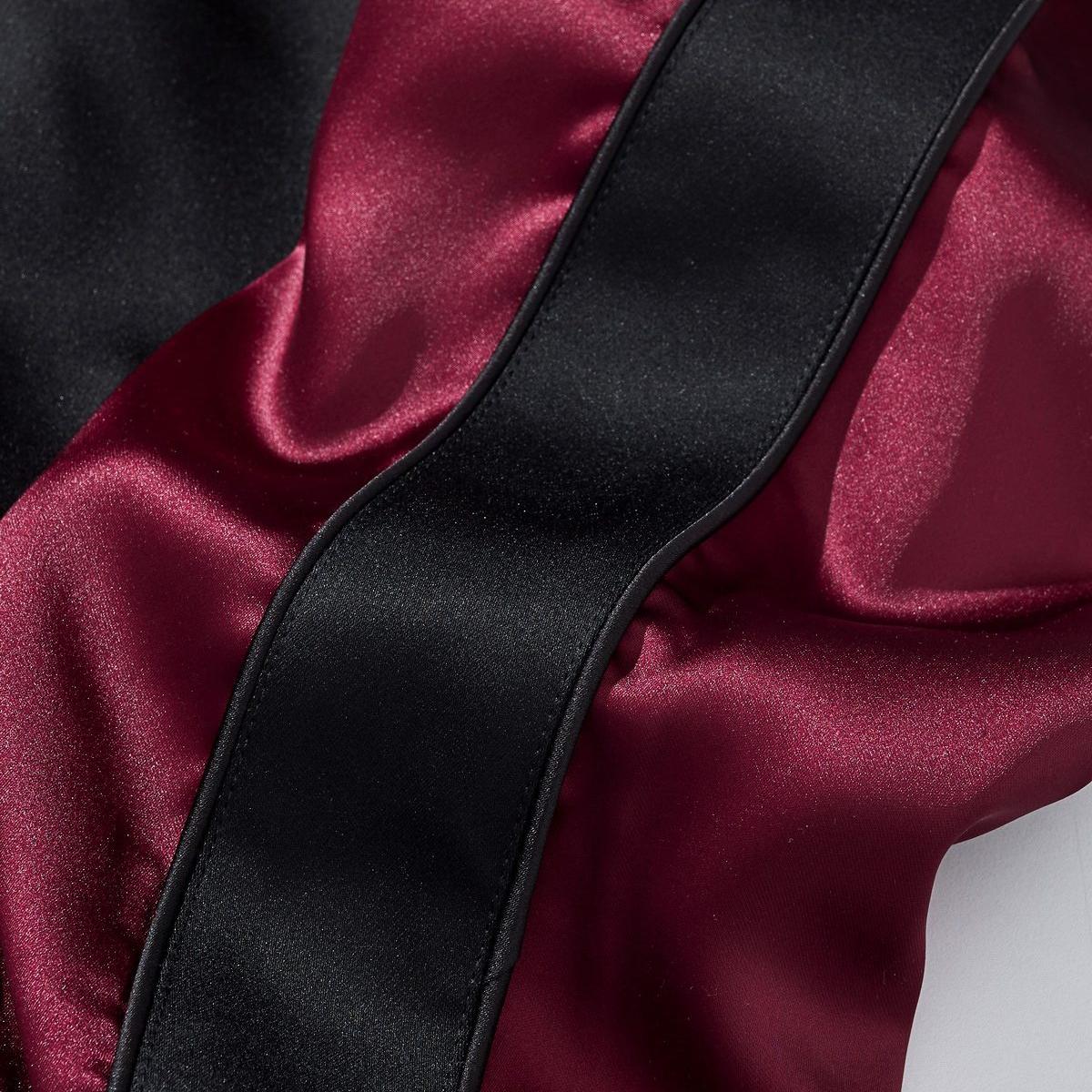 Sleeve panel in burgundy satin with black contrast stripe