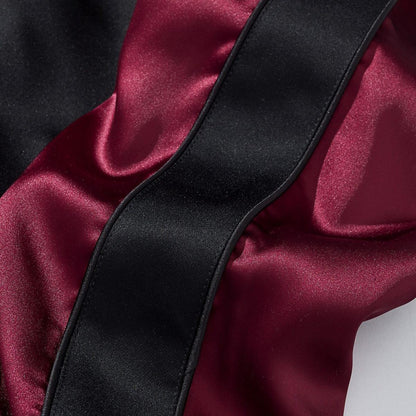 Sleeve panel in burgundy satin with black contrast stripe