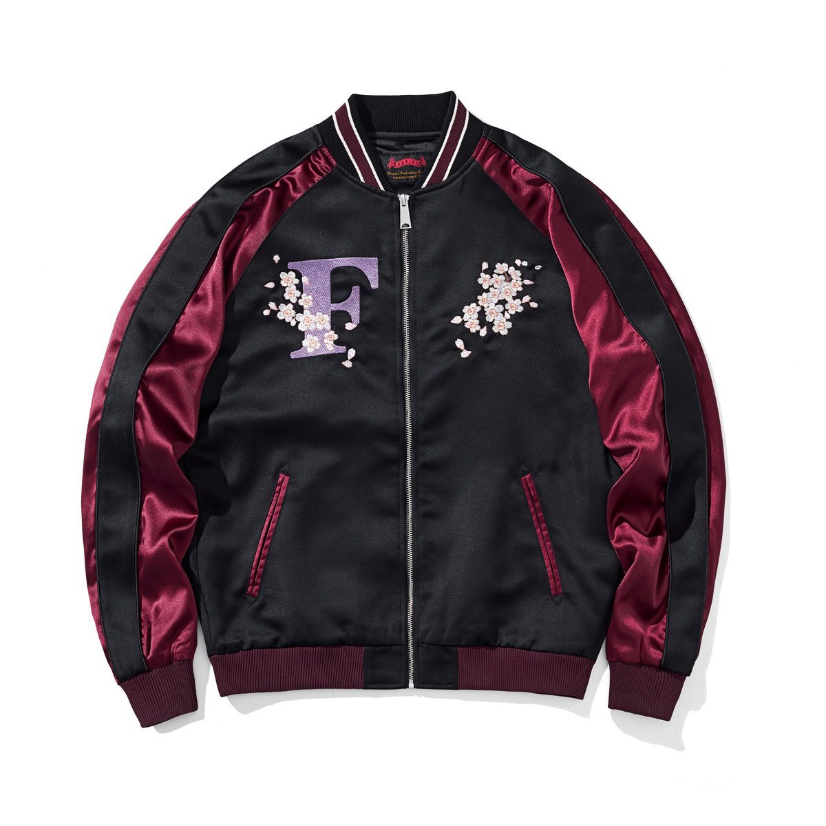 Front view with twin cherry blossom crests and initial “F”.