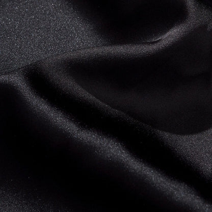 Close-up of the satin fabric showing a smooth sheen and fine texture