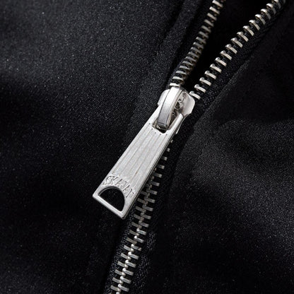 Metal zipper pull close-up with crisp teeth