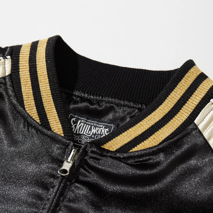 Close-up of ribbed collar and Skullworks label on black satin Dragon Ball Rider embroidered sukajan jacket.