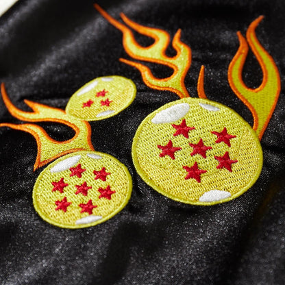 Close-up of flaming dragon balls chest embroidery on Dragon Ball Rider anime sukajan bomber jacket.