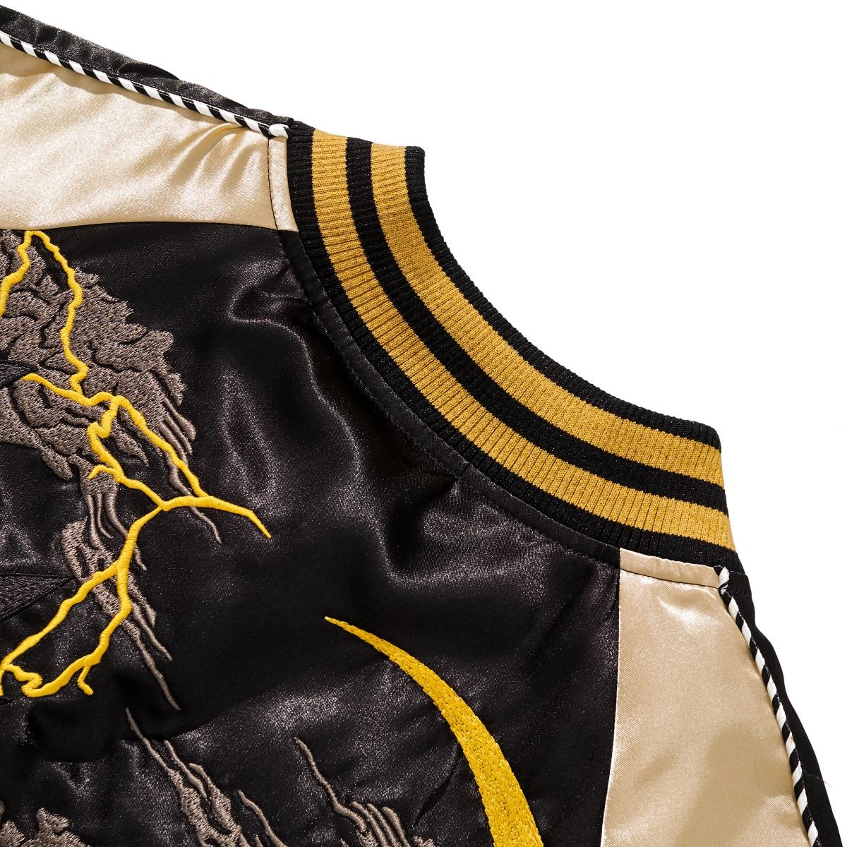 Detail of striped ribbed collar and lightning cloud embroidery on Goku Kamehameha Dragon Balls sukajan jacket.