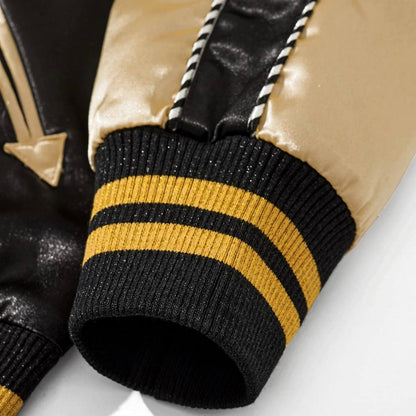 Detail of striped ribbed cuff and beige sleeve on Dragon Balls Goku Kamehameha sukajan jacket.