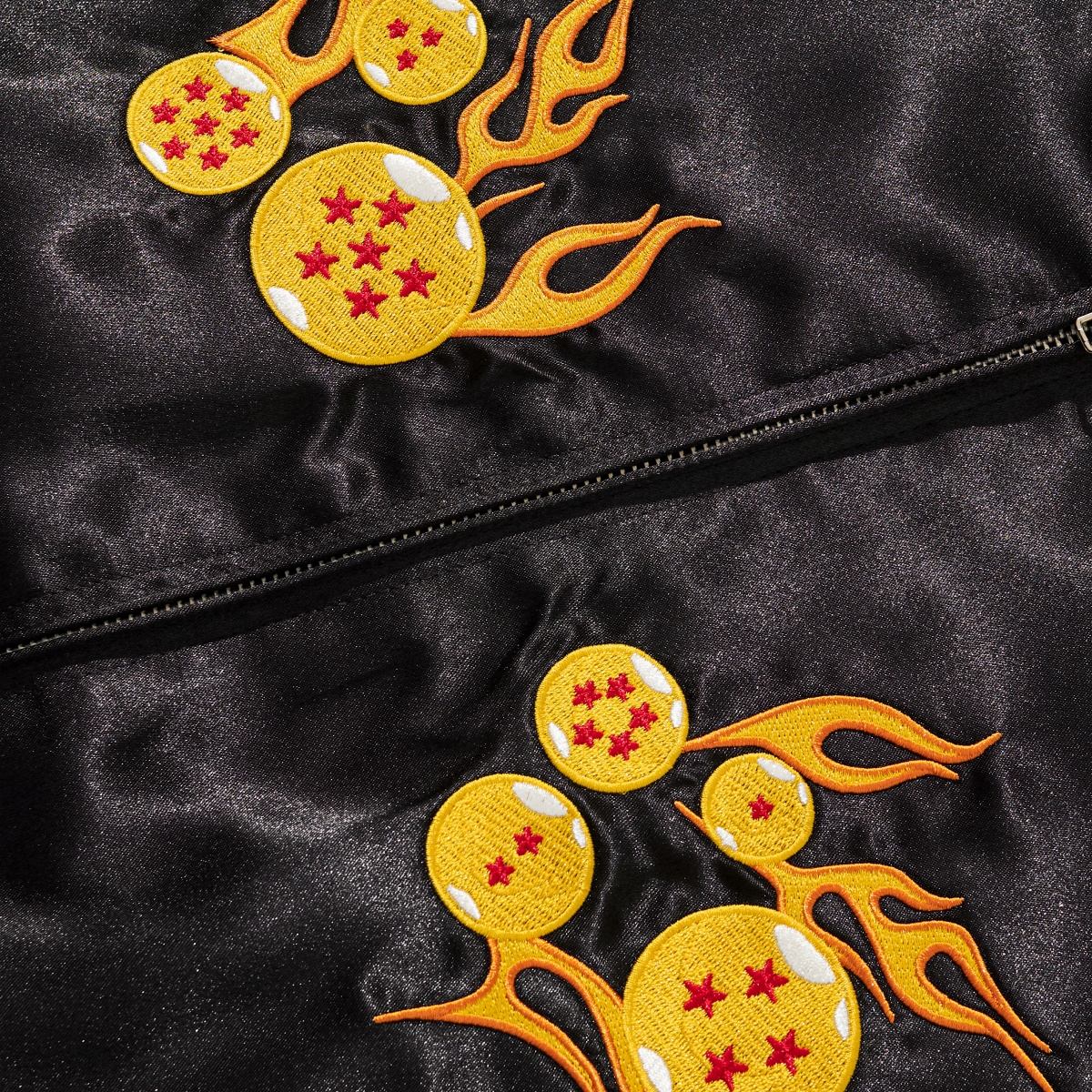 Close-up of flaming dragon balls chest embroidery on black satin Dragon Balls sukajan jacket.