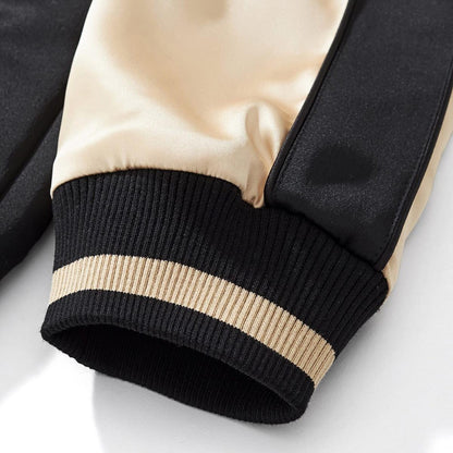 Elastic ribbed cuff with contrast stripe for a snug, wind-resistant seal.