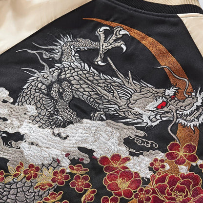 Dense metallic-thread dragon embroidery over a crescent motif, rich texture and crisp edges