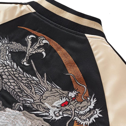 Shoulder detail — moon ring arc with fierce dragon head; smooth satin sleeve panel.