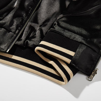 Striped rib-knit hem and zipper end detail of the sukajan jacket.