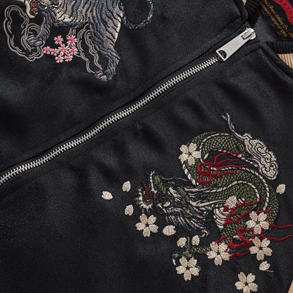 Close-up of dragon & tiger crests with dense satin stitching