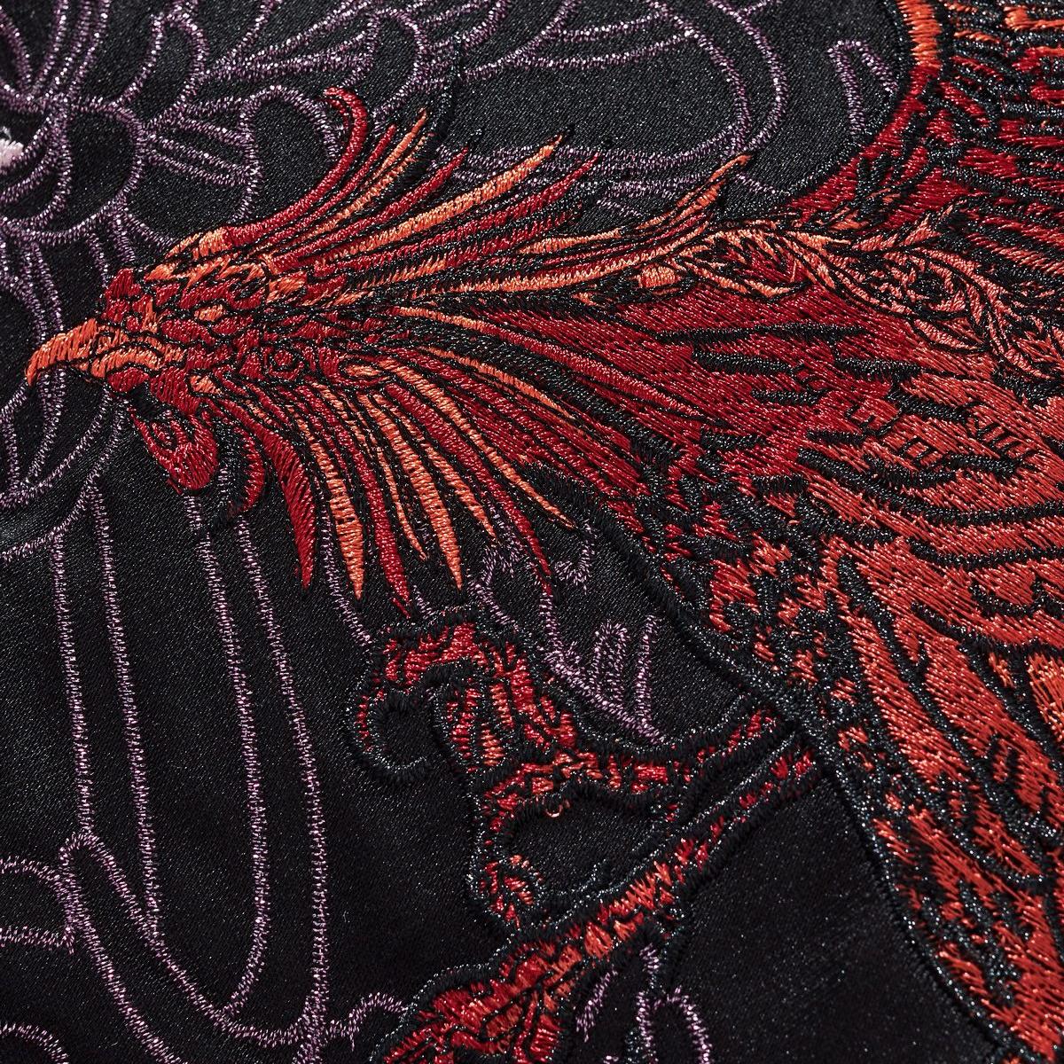 Phoenix wing embroidery with layered threadwork and texture