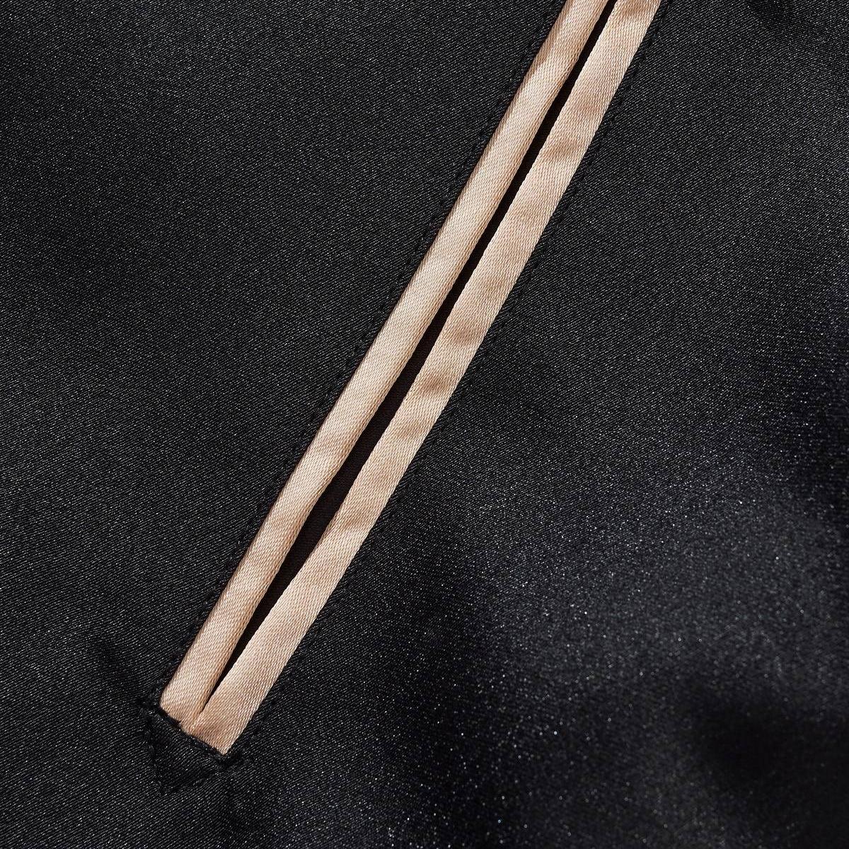 Close-up of the slanted welt pocket with clean, piped edges