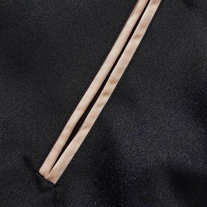 Close-up of the slanted welt pocket with clean, piped edges
