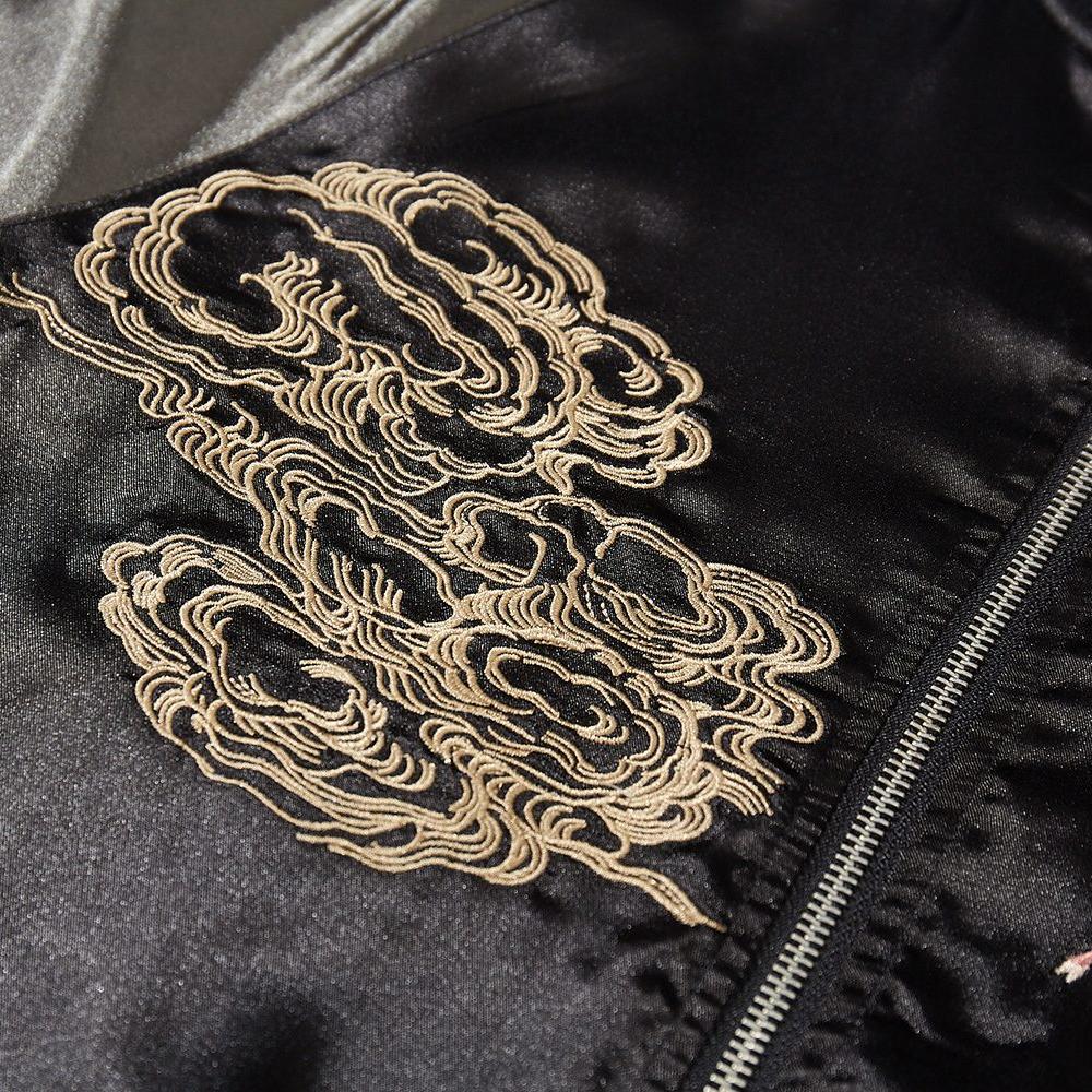 Close-up of cloud embroidery on the front panel of a black sukajan