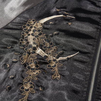 Close-up of crescent moon with blossoms embroidery