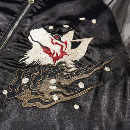 Close-up of fox head embroidery with swirling mist and petals on the front