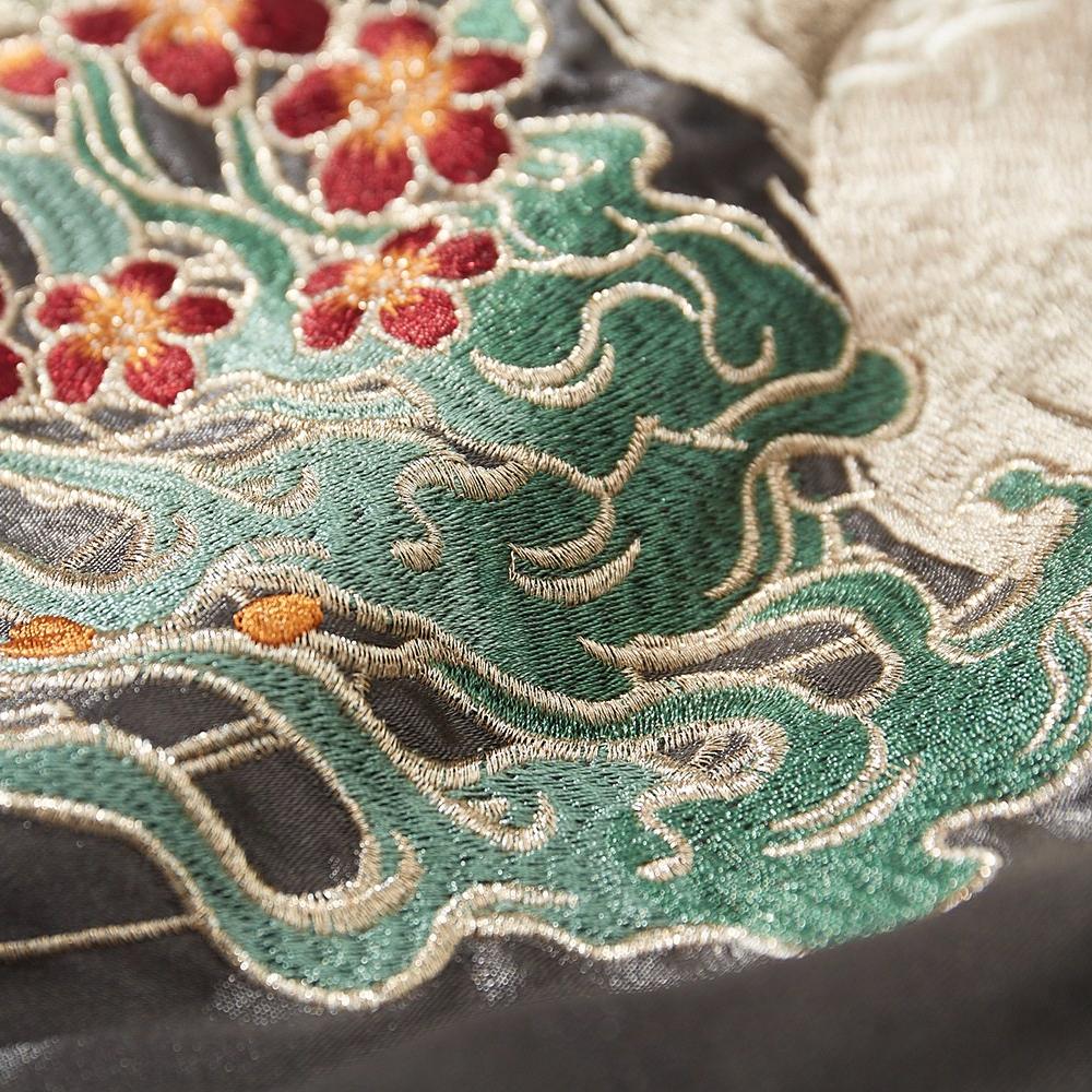 Close-up of wave embroidery with blossoms
