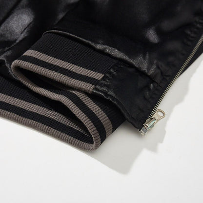 Close-up of striped ribbed hem with zipper end on a sukajan