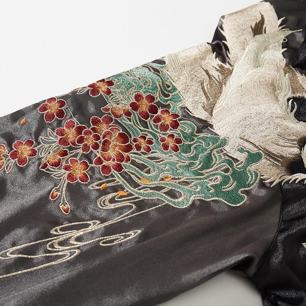 Sleeve embroidery close-up with blossoms and waves