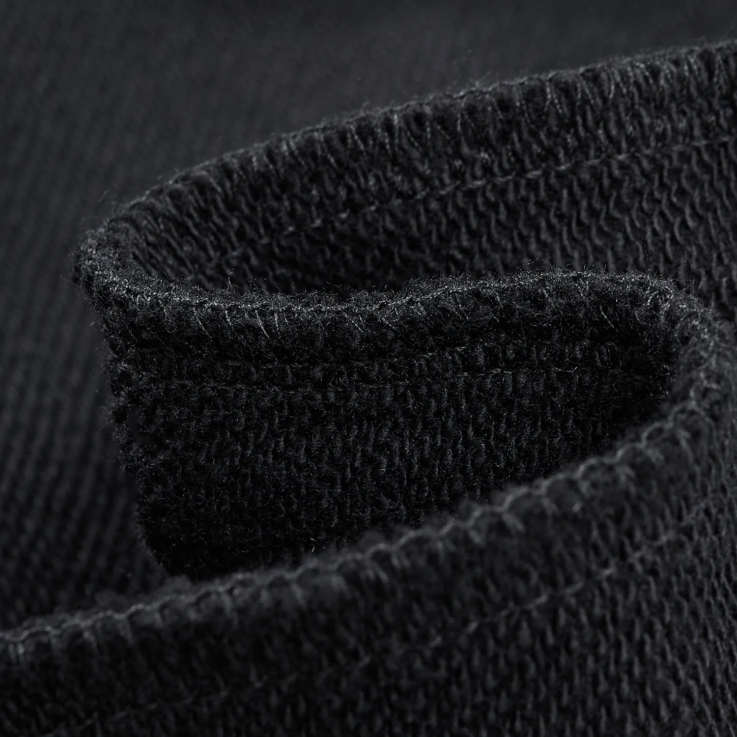 Close up of soft black loopback fleece lining of Nine-Tailed Fox & Lotus sweatshirt
