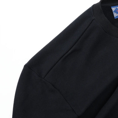 Shoulder and sleeve construction detail on black Nine-Tailed Fox & Lotus sweatshirt