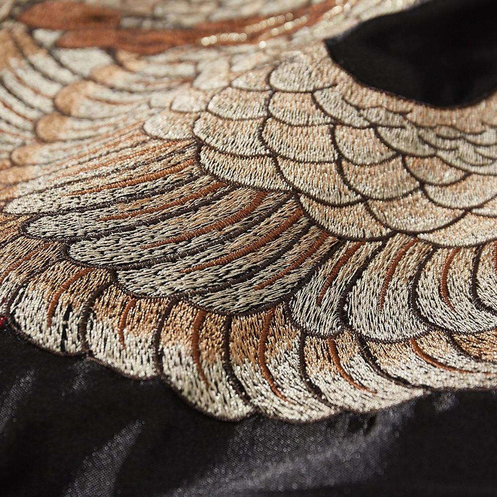Close-up of layered phoenix plumage embroidery