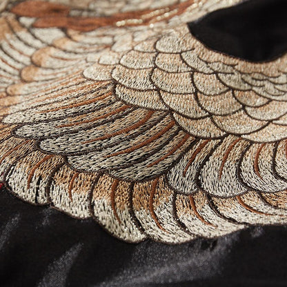 Close-up of layered phoenix plumage embroidery