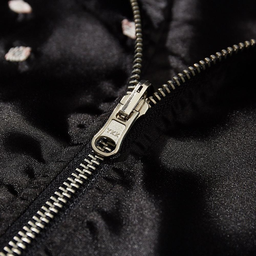 Close-up of metal zipper on a sukajan