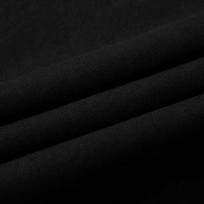 Black cotton jersey fabric folded—smooth handfeel and fine knit texture