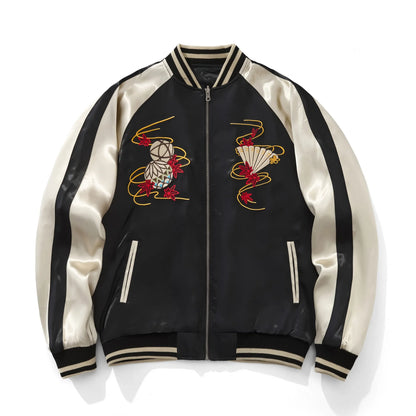 Front view of black and beige souvenir jacket with Temari ball and folding fan chest embroidery.
