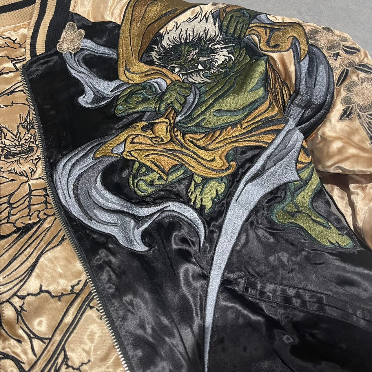 Fujin embroidery detail at the front—wind swirls and flowing robe on the sukajan jacket.