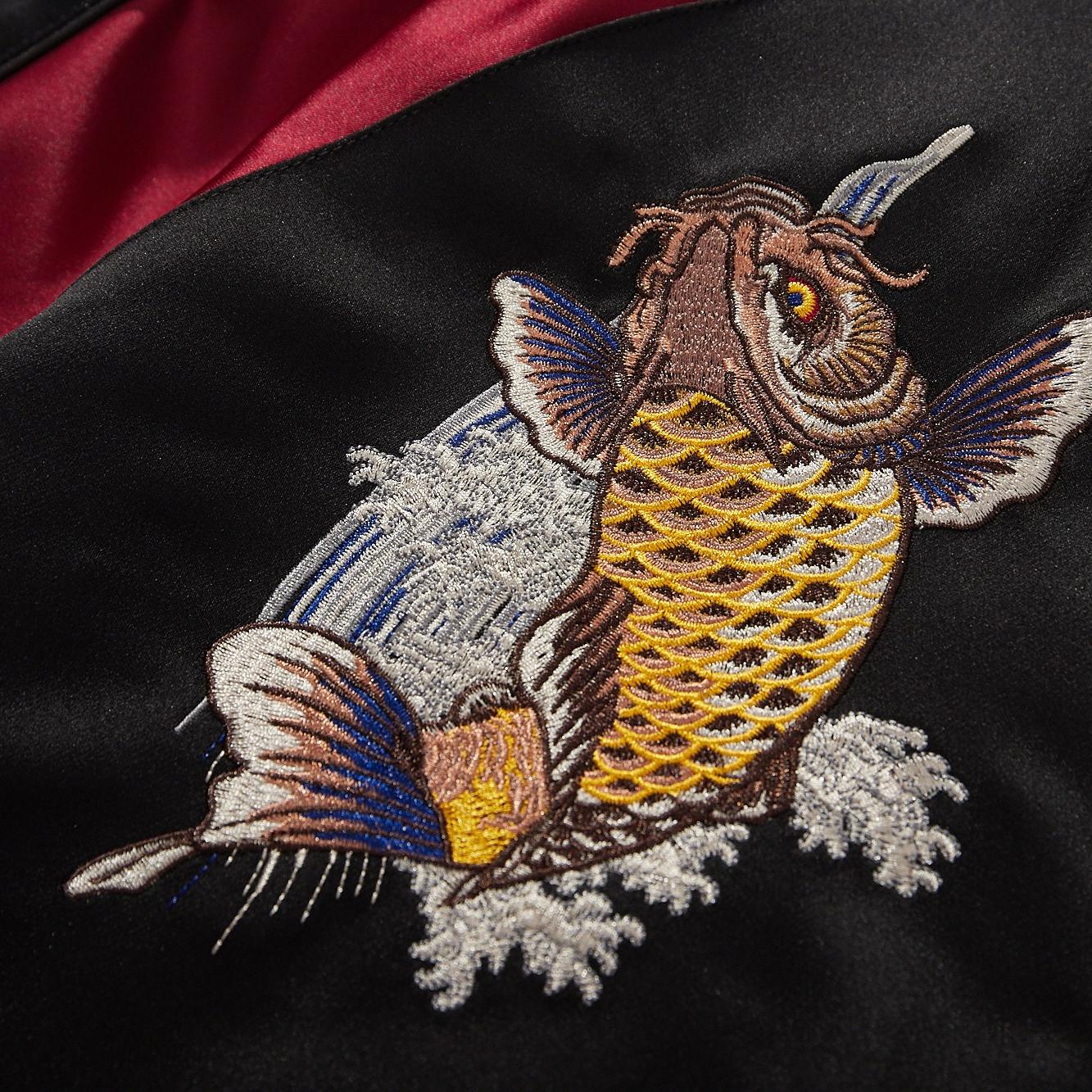 Front chest koi crest embroidery close-up with splash effect