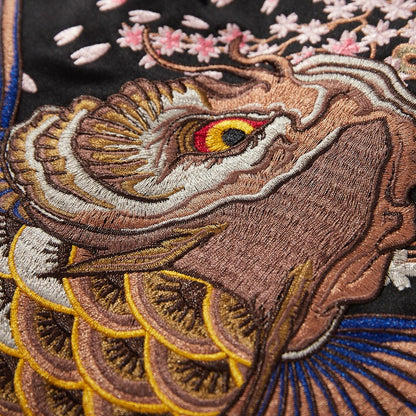 Close-up of koi head embroidery with layered threads and gradient scales