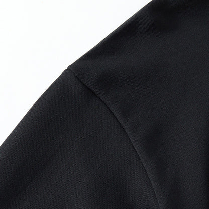 Shoulder seam detail on the black sweatshirt with smooth fabric and neat seams